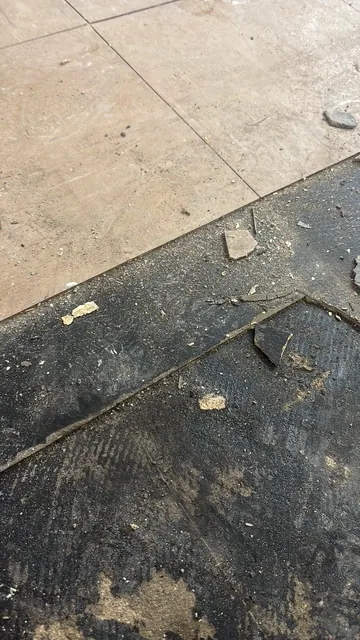 Black bitumen mastic floor removal in a W9 flat